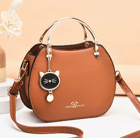 New Round Handle Purse shoulder bag women hand bags Small Hand Pu Leather Luxury Bags Women Handbags Ladies with cat pendant (Brown)